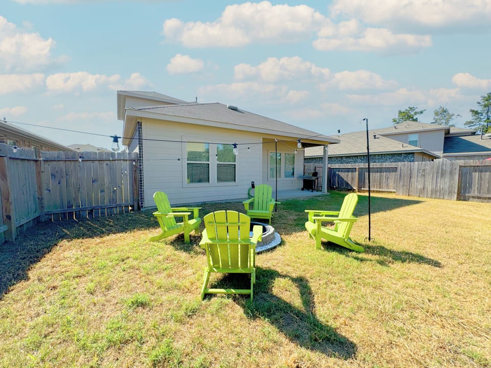 Fire pit area in a fully fenced backyard