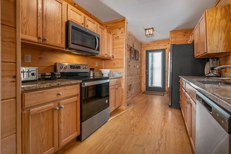 Kitchen is outfitted with an Electric Range