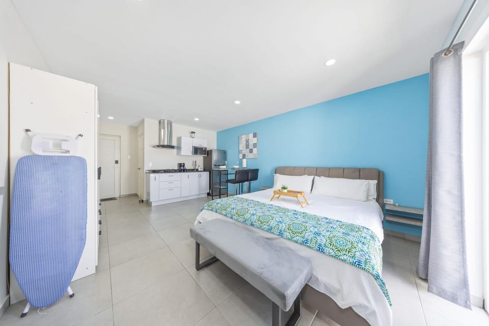 Unwind in style with our open-concept studio layout, complete with a plush king-size bed and smart TV—perfect for a cozy night after a day on Aruba’s beaches. Relax, recharge, repeat!