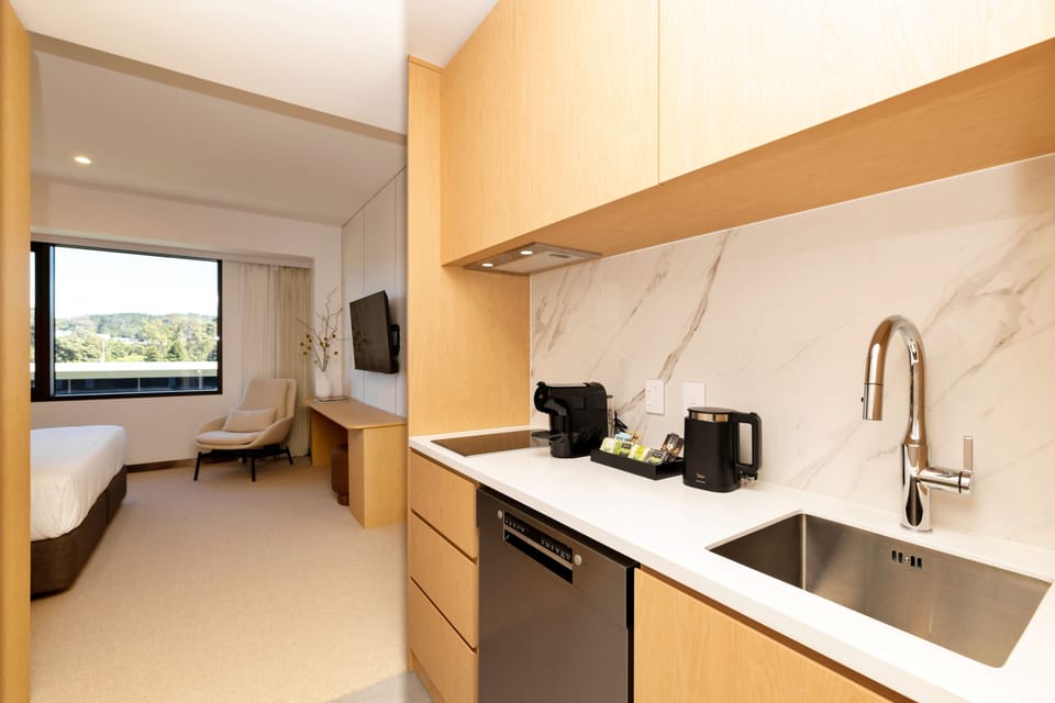 Urban Home | Premium bedding, in-room safe, blackout drapes, soundproofing