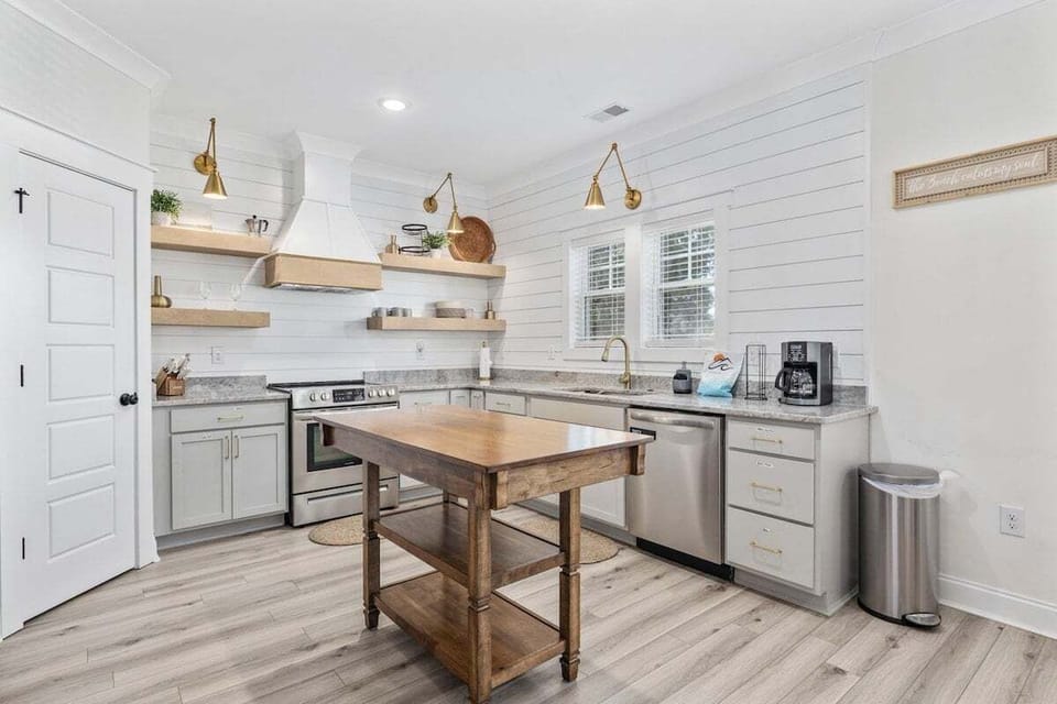 This open-concept kitchen is perfect for gathering—prepare meals, snack, or sip coffee while staying connected with loved ones in the living and dining areas