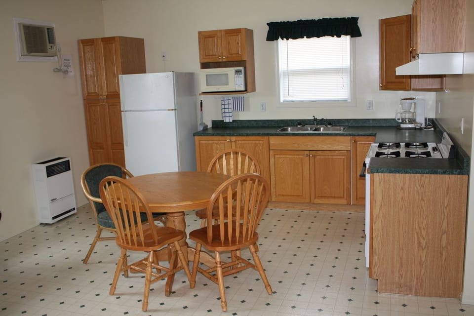 Executive Suite | Private kitchen | Fridge, coffee/tea maker, cookware/dishes/utensils