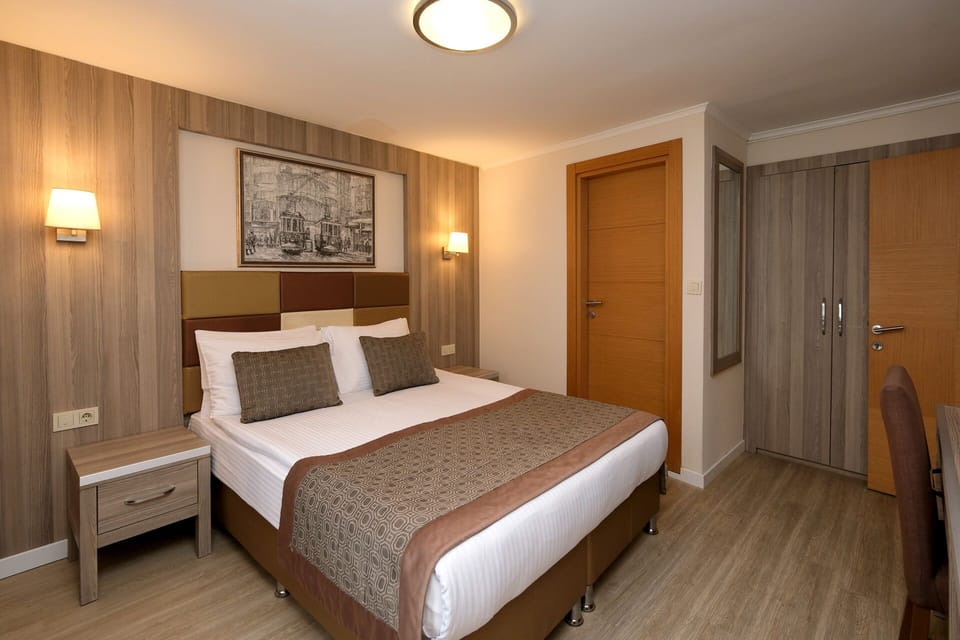 Family Quadruple Room | Premium bedding, minibar, in-room safe, desk