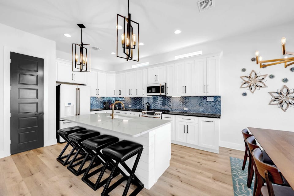 This stunning and sleek kitchen is stocked with your cookware essentials