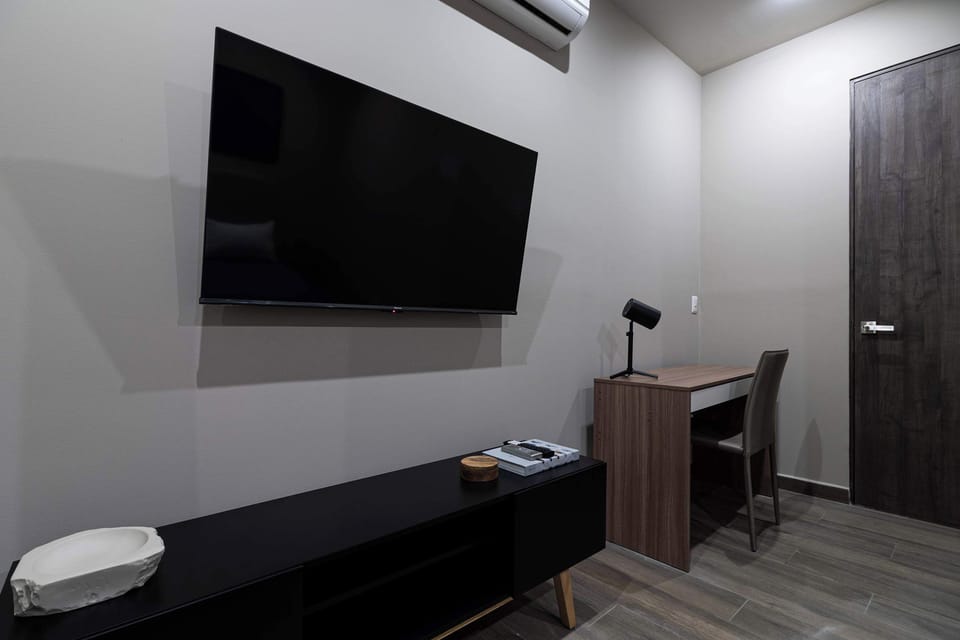 Functional workspace inside the bedroom, ideal for remote work.