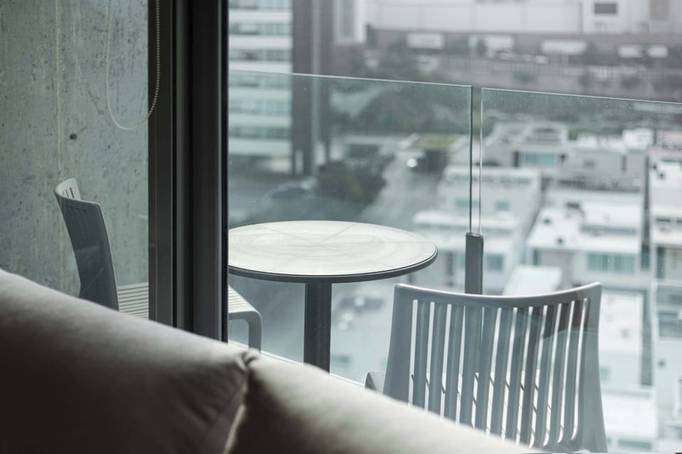 Private balcony, ideal for sunset dinners with skyline views.