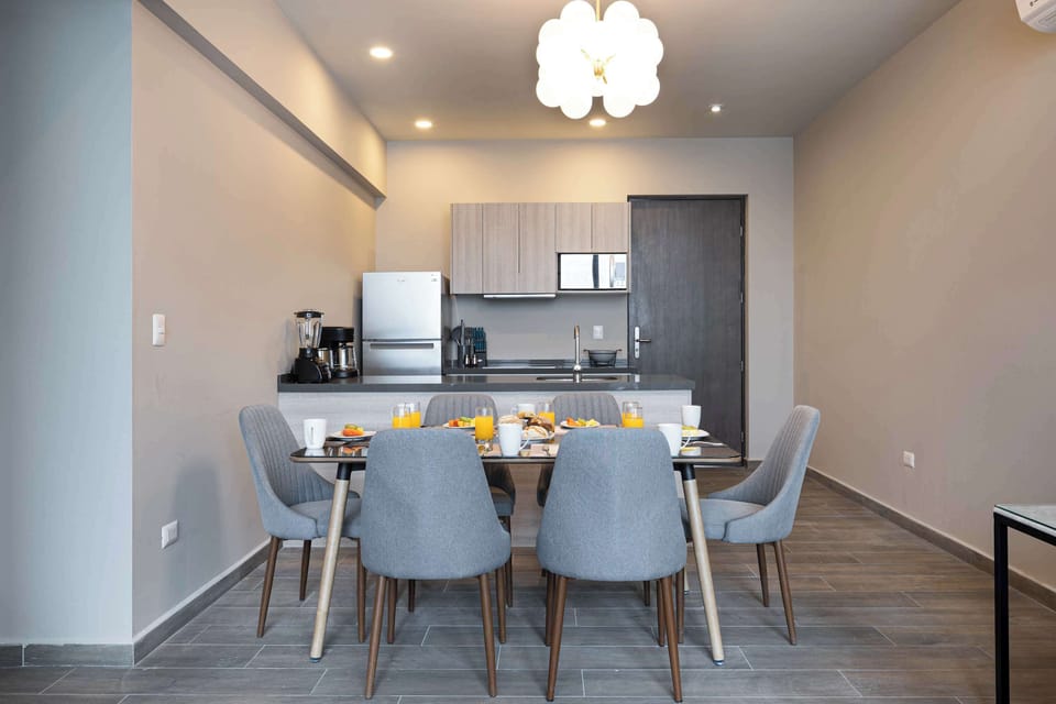 Enjoy meals with stunning city views in the dining area.