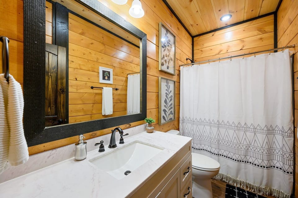 Refresh and rejuvenate in the first-floor hall bathroom, offering a tub/shower combo and all bathroom essentials.