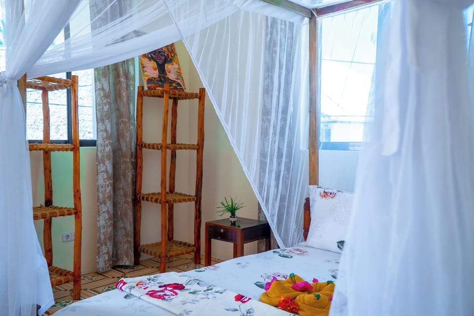 Family Quadruple Room, Balcony | Free WiFi, bed sheets