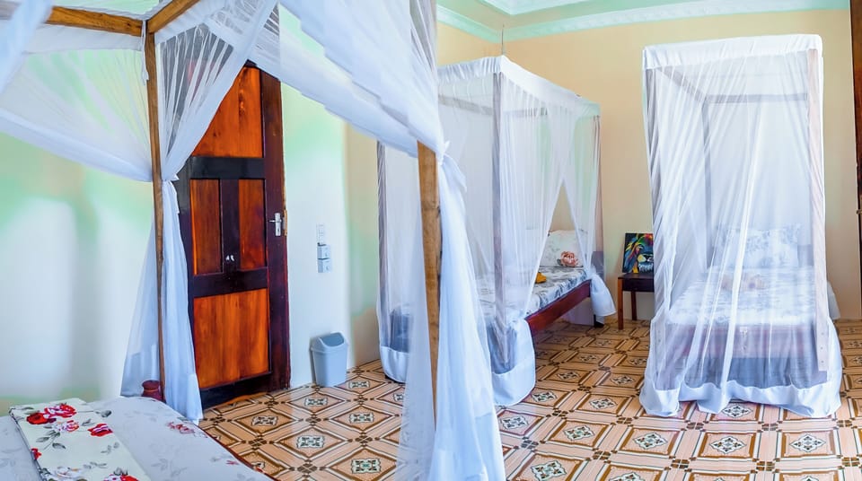 Family Quadruple Room, Balcony | Free WiFi, bed sheets