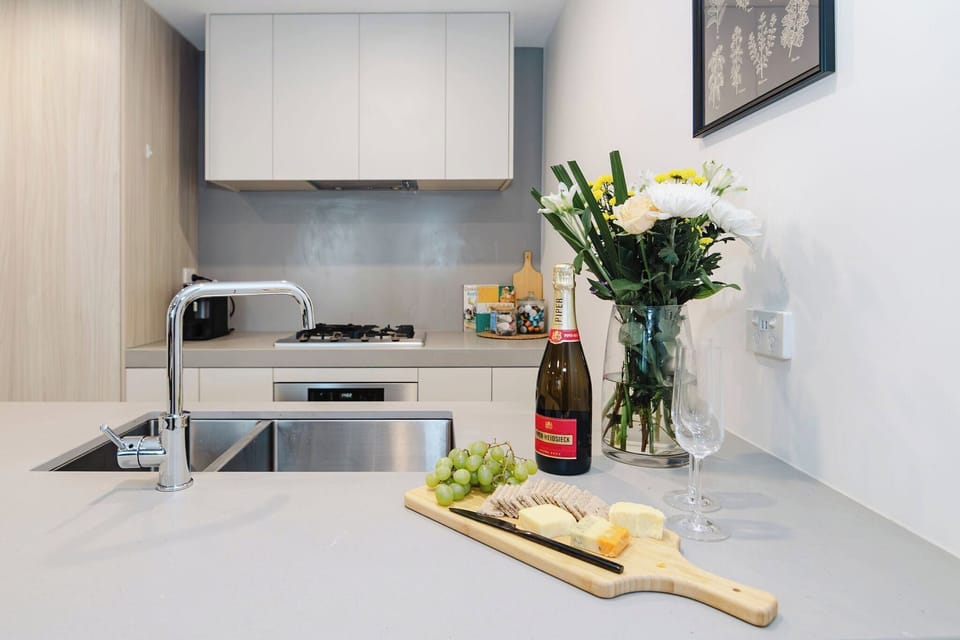 Experience effortless elegance at this sleek kitchen counter, featuring a modern sink that combines style with functionality for all your culinary adventures