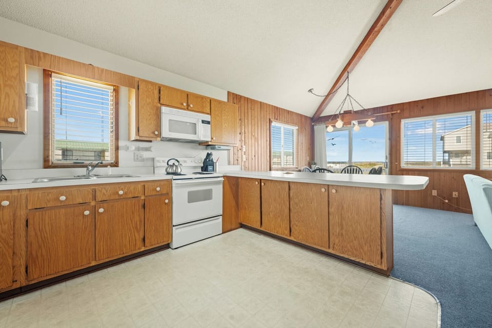 Kitchen with Bar Stool Seating on Third Level with Ocean Views