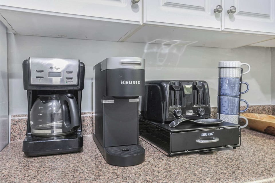 A Keurig and a regular drip coffee maker for your convenience. 