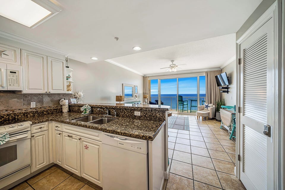 The fully equipped kitchen features granite countertops and has everything you need to prepare meals for family & friends.