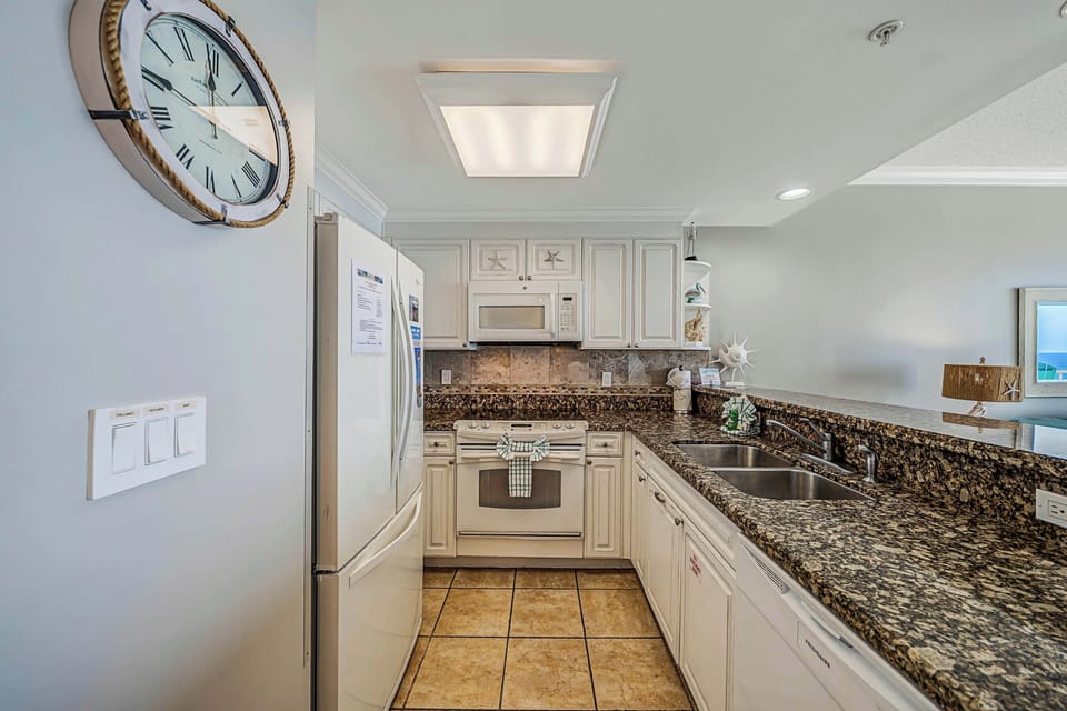 The fully equipped kitchen features granite countertops and has everything you need to prepare meals for family & friends.