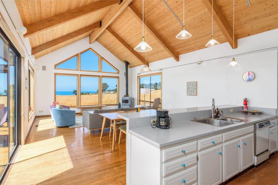 Open living and dining space with patio access.