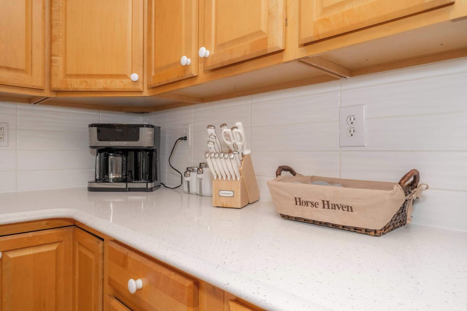 The warm, inviting kitchen offers ample space & all the comforts of home