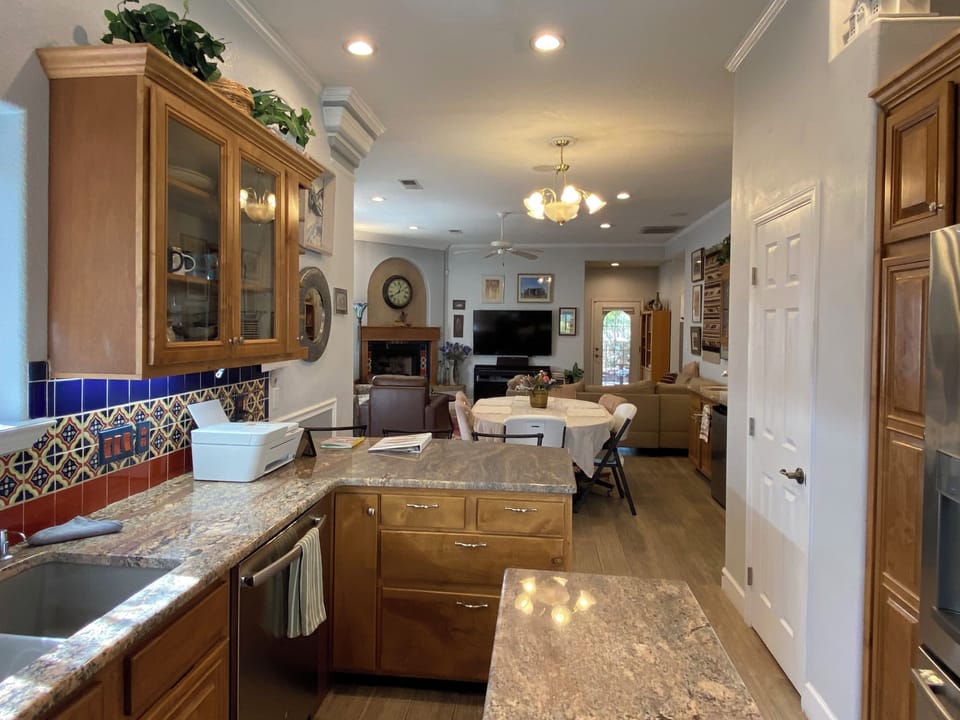 Kitchen (Coffee Bar and both Bathrooms) have granite countertops.