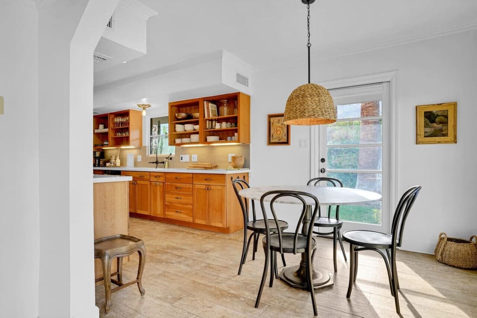 An extra chair and table for either tea or chat while preparing meals