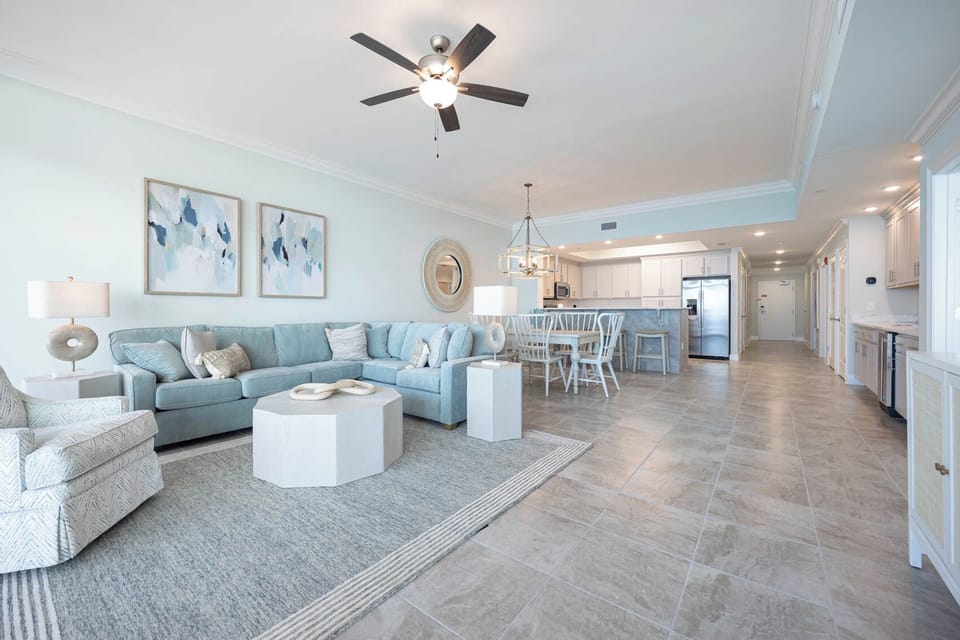 Gather in this welcoming living space and enjoy stunning beach views through the windows