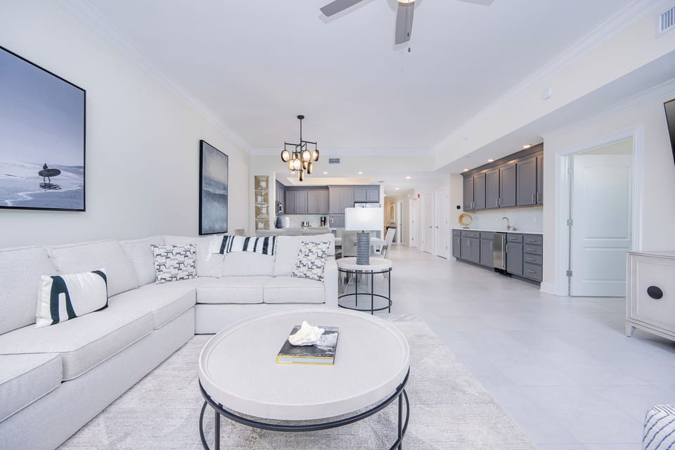 Relax on the cozy sofa with a queen sleeper in this inviting family room with breathtaking beachfront views