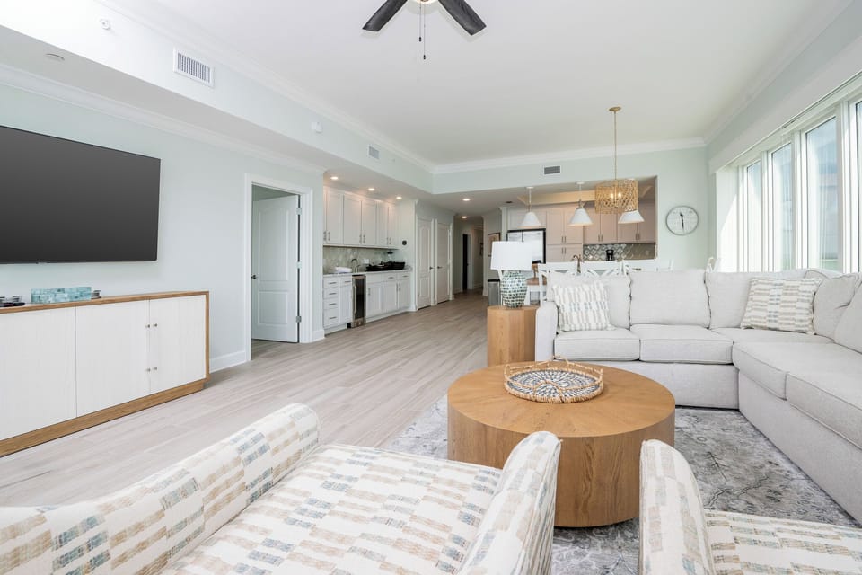 Relax on the cozy sofa with a queen sleeper in this inviting family room with breathtaking beachfront views