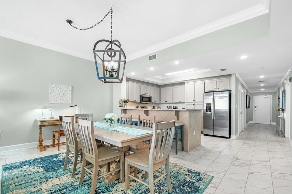 Savor a family meal or enjoy a fun game night with beautiful beach views and elegant accents