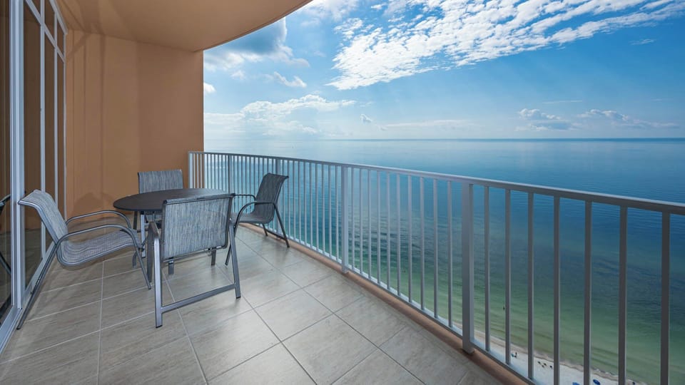 Relax on the balcony chairs, listening to gulf waves and watching the beach and horizon disappear into the sky