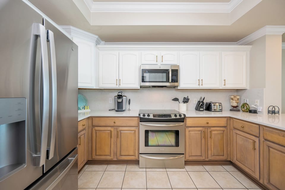 Stainless steel appliances await your family's homemade meals in this cozy kitchen space
