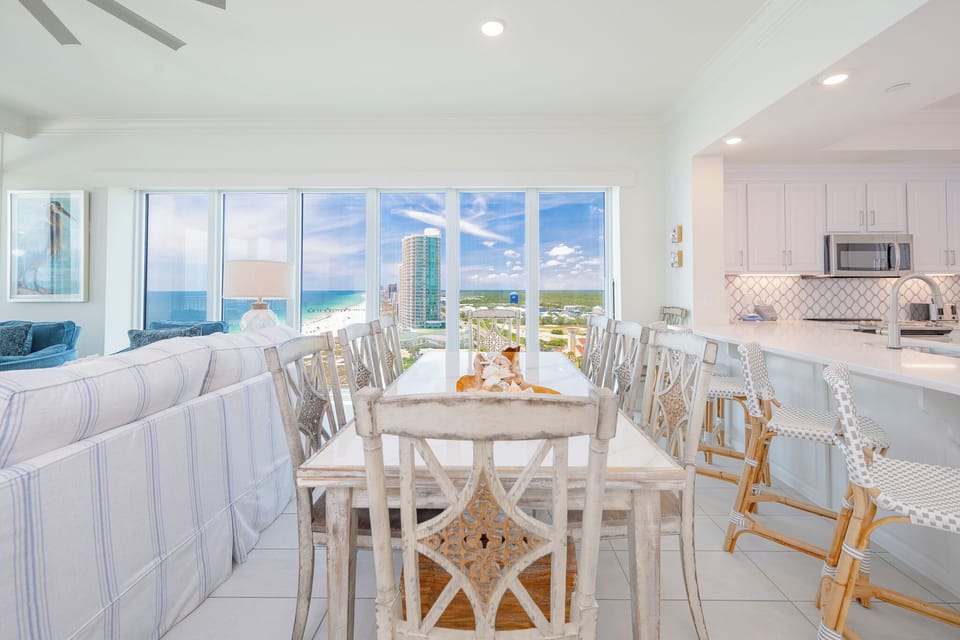 Gather around the dining table as coastal breezes carry the sounds of waves and distant laughter nearby
