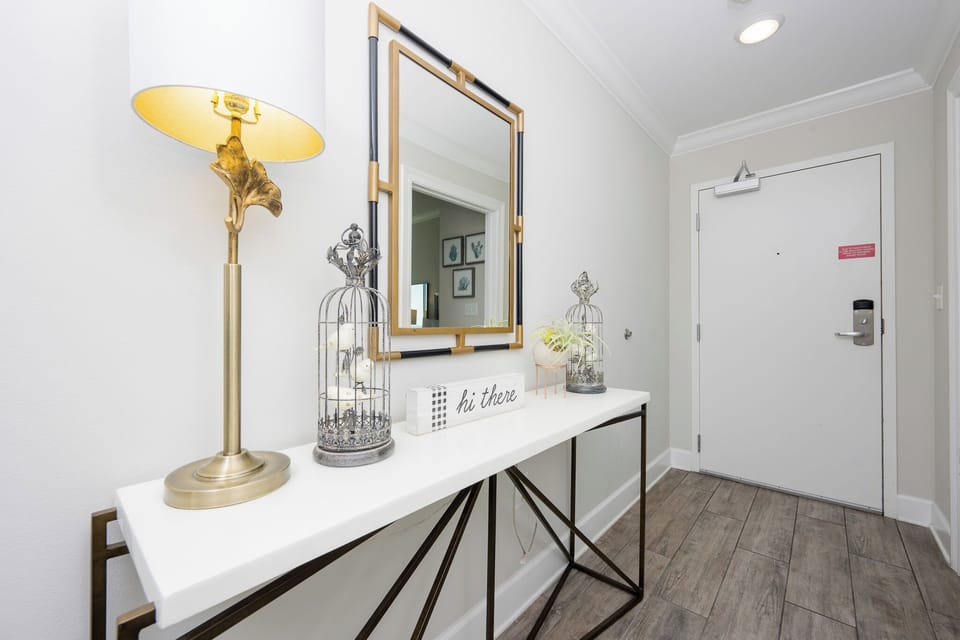 Step into a welcoming entryway, where thoughtful decor invites you to unwind and begin your coastal getaway