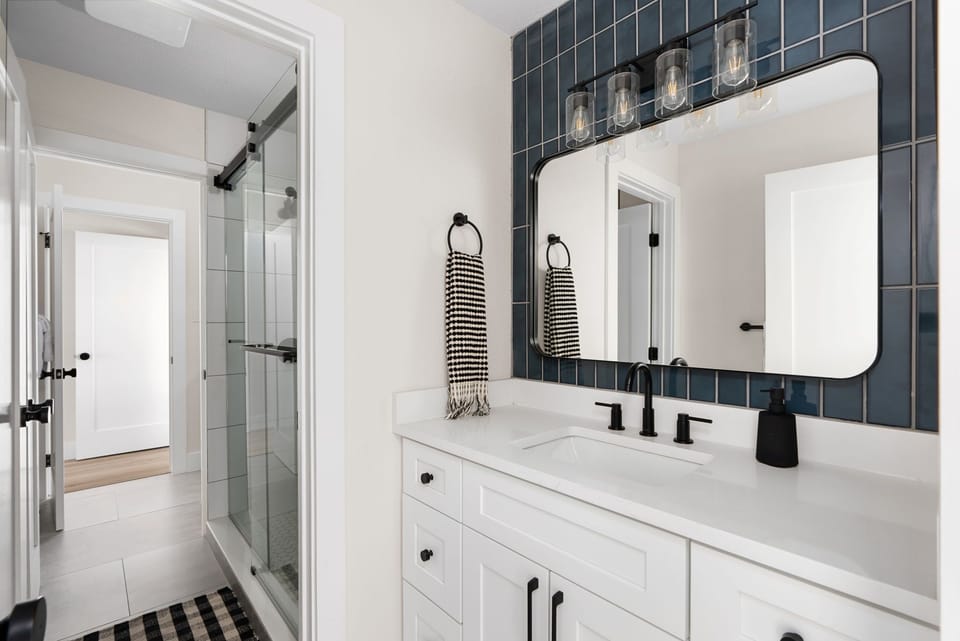 Our Jack-n-Jill full bath is the ultimate sharing solution with TWO separate sink areas—no more fighting over who gets to brush their teeth first!