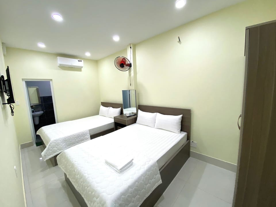 Family Room | Memory foam beds, minibar, desk, blackout drapes