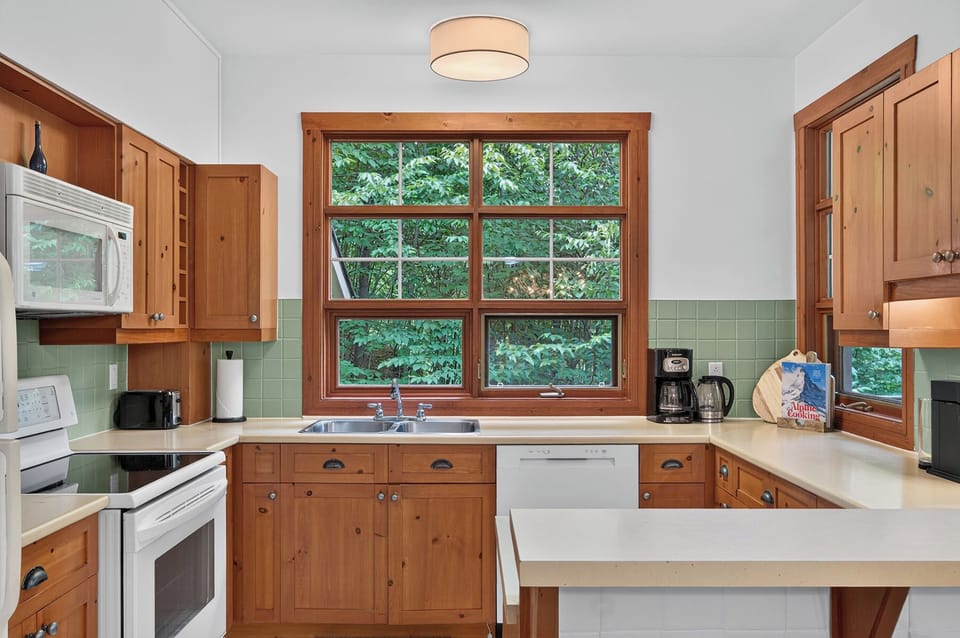 Family Condo | Private kitchen | Full-size fridge, microwave, oven, stovetop