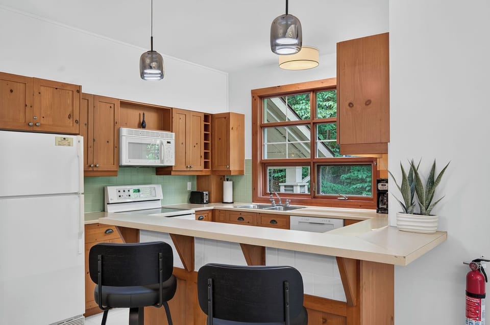 Family Condo | Private kitchen | Full-size fridge, microwave, oven, stovetop