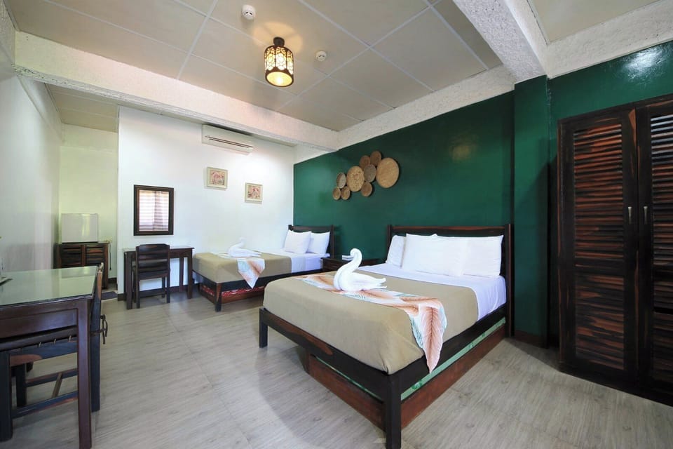 Deluxe Quadruple Room | Premium bedding, minibar, in-room safe, desk