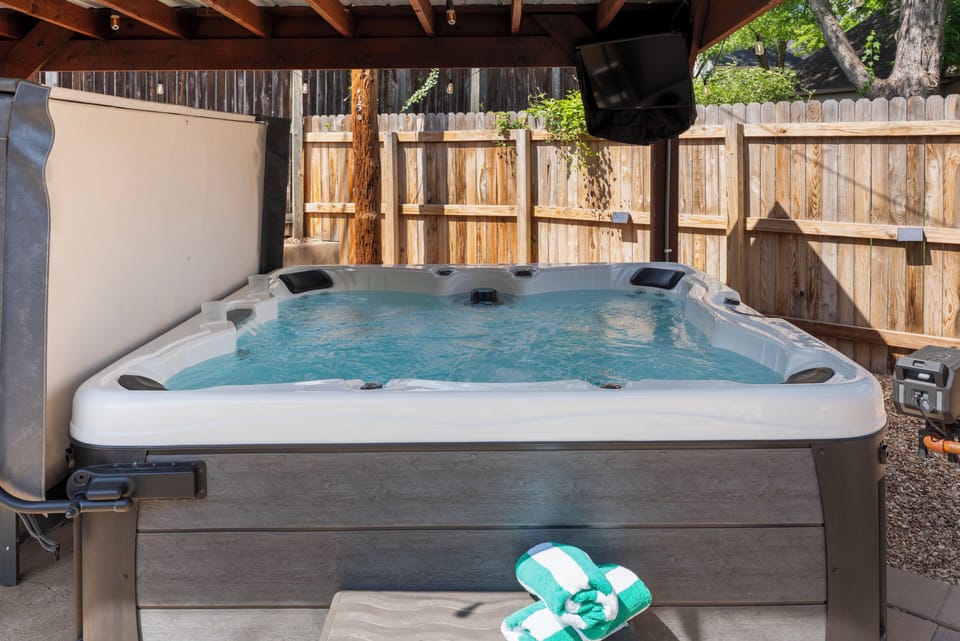 Hot tub + string lights + outdoor TV + fire pit = the perfect summer evening!
