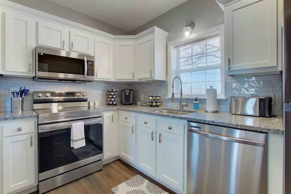 ✨ Sparkling clean and ready for you! Our modern kitchen offers everything you need, from a coffee station to a full-size oven and dishwasher.