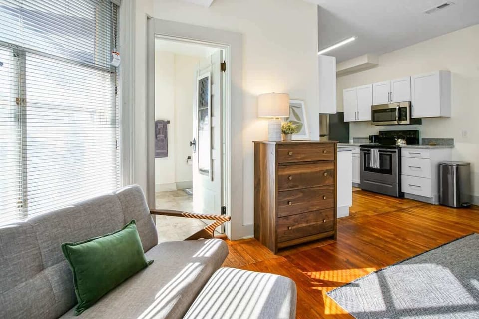 Comfy window-side seating area just steps from the kitchen & main living space