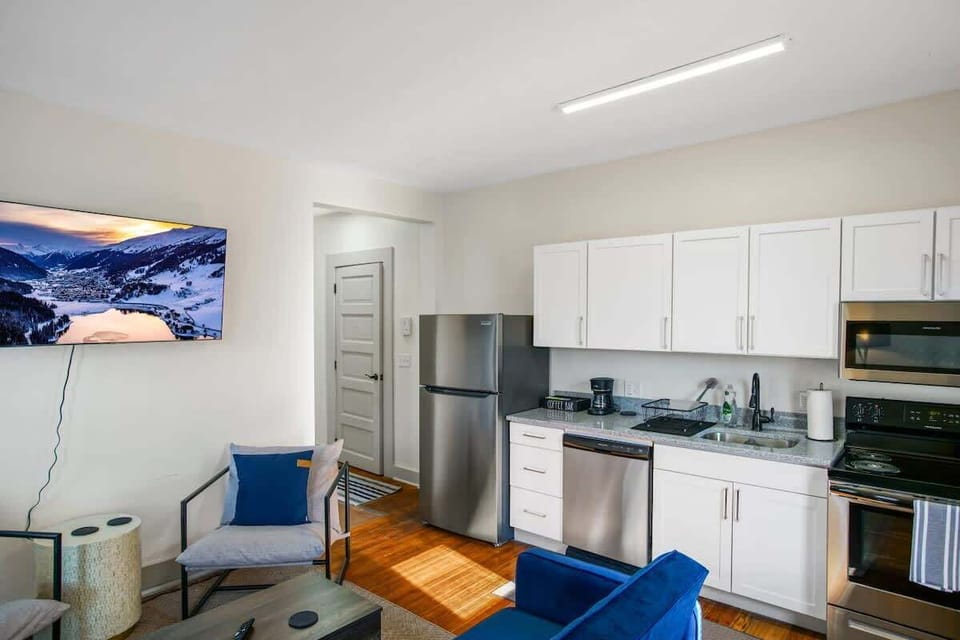 Open kitchen w/ stainless appliances & cozy seating area perfect for relaxing after a day out