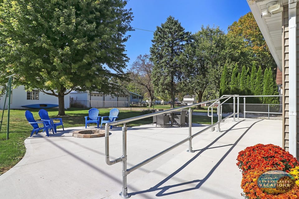 Handicap ramp to the home. Patio with dining table and firepit