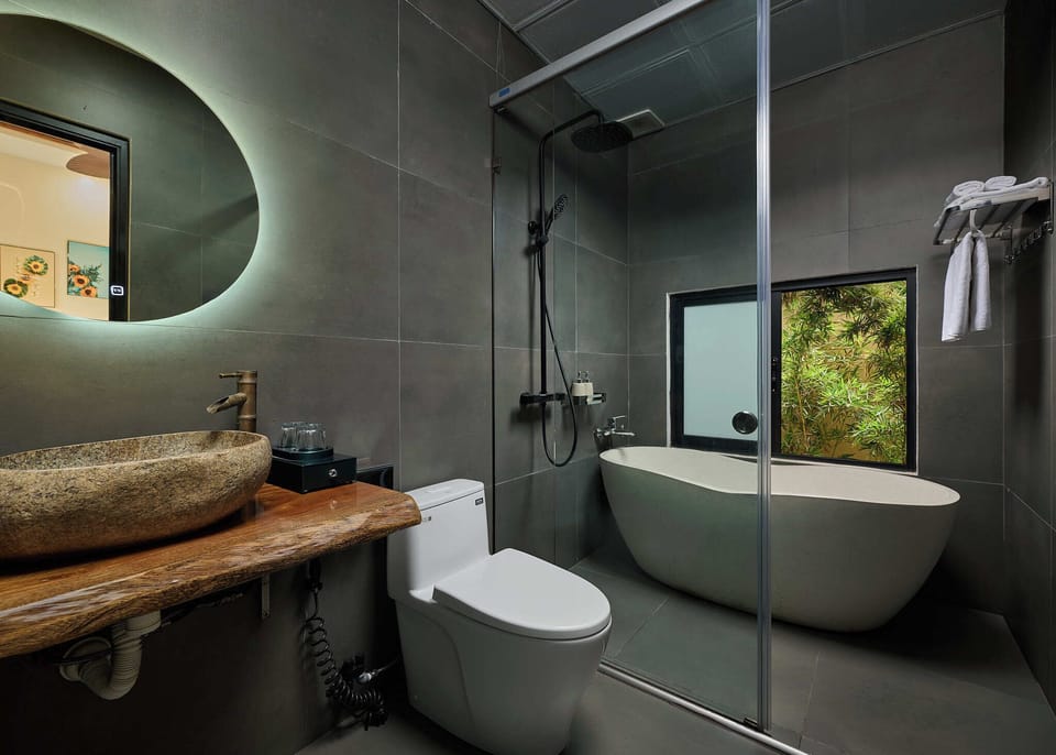 Deluxe Triple Room, Bathtub, Pool View | Bathroom | Eco-friendly toiletries, hair dryer, slippers, bidet