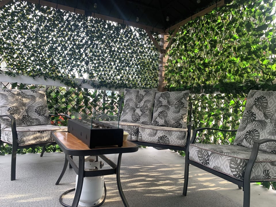 Balcony lounging area with fire pit table - smoking area