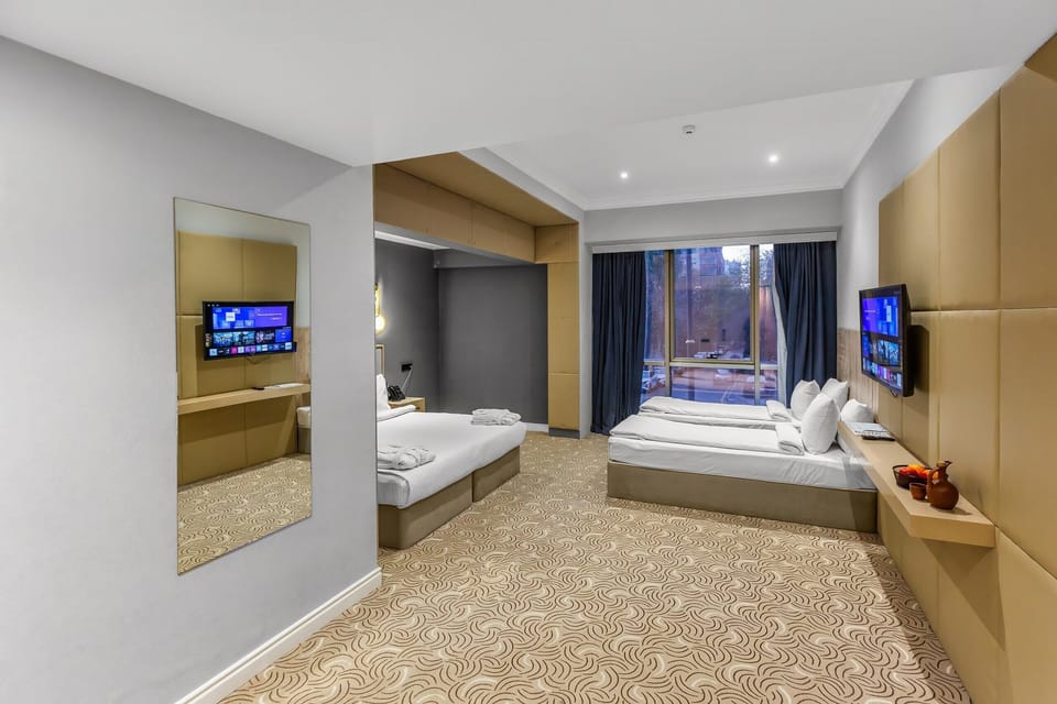 Deluxe Quadruple Room | Egyptian cotton sheets, premium bedding, down comforters, minibar
