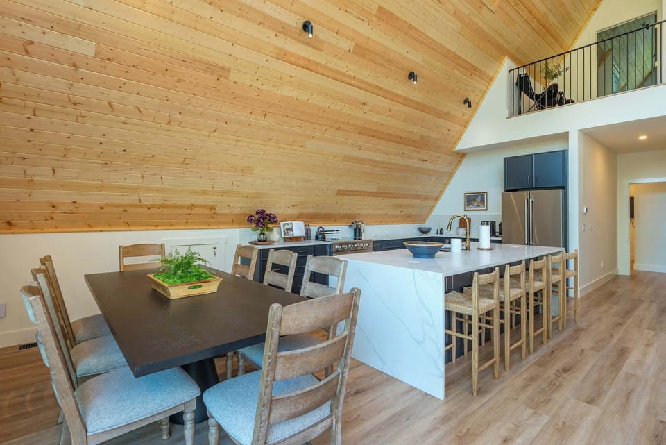 Dining area with table for 8! There are 4 folding chairs in the laundry room to add more seating! 