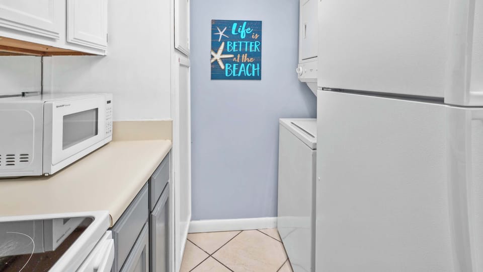The full kitchen has everything you need to whip up family meals--plus a tucked-away washer + dryer to keep your clothes fresh!