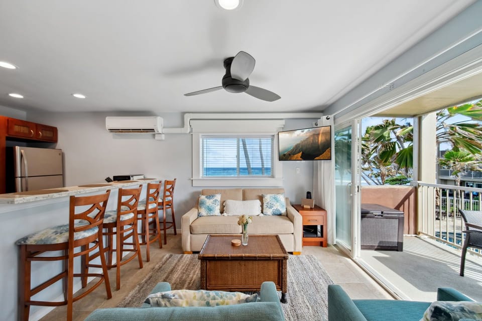 Cozy oceanfront living room with sofa sleeper and cable TV