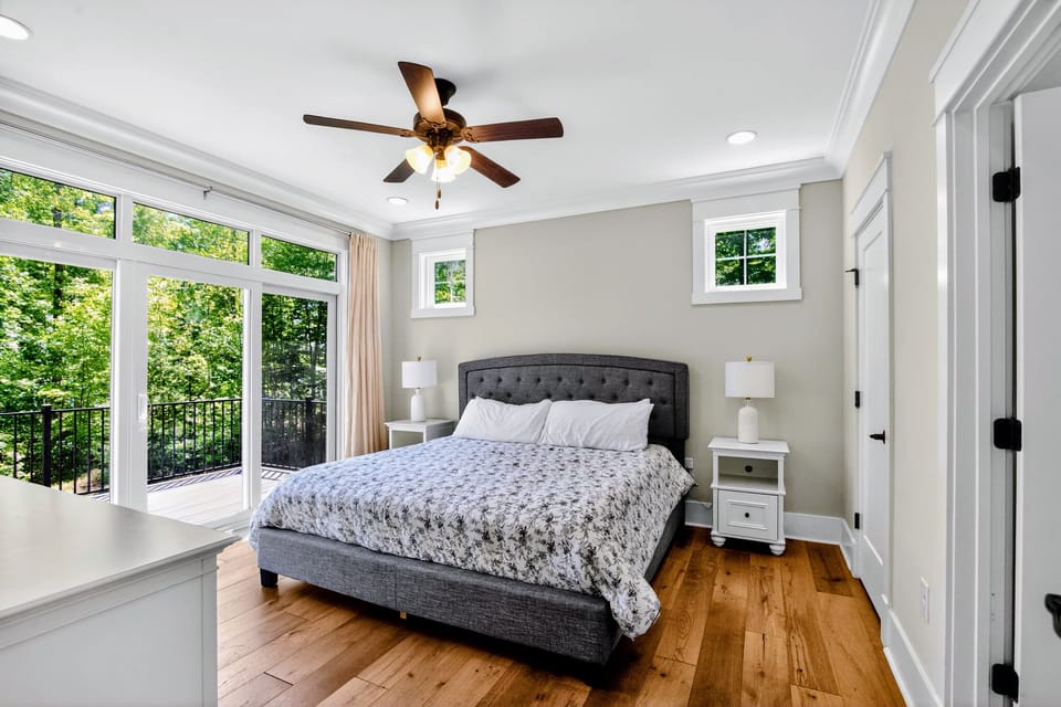 Suite 1 - King bed framed by glass, step straight onto your private balcony with the lake breeze for company.