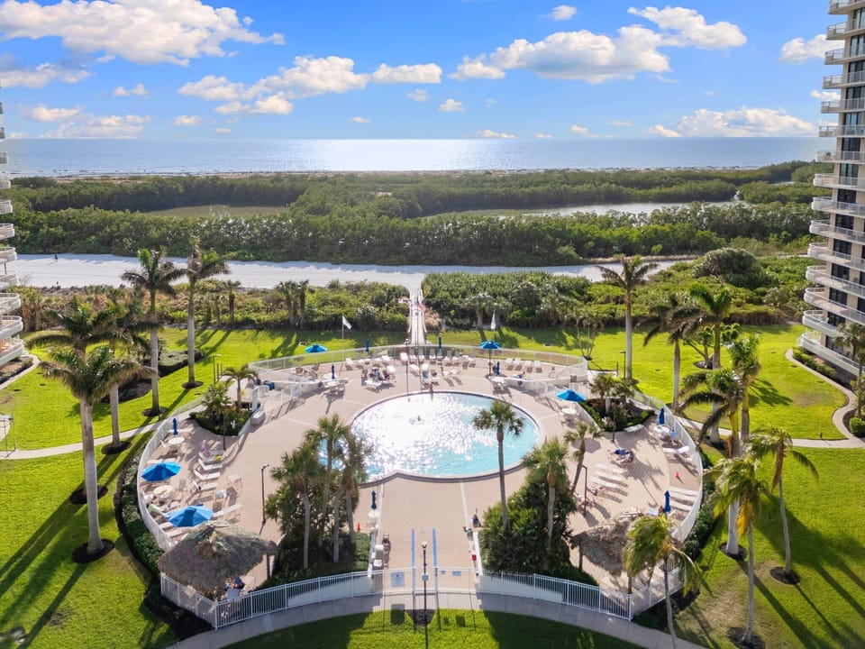 Large, heated pool with loungers