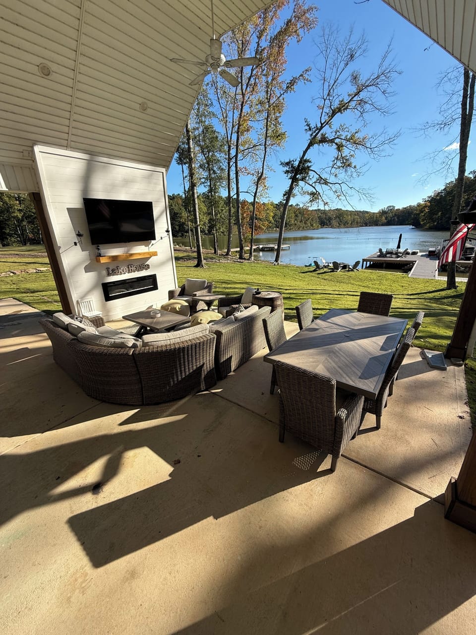 Beautiful and spacious patios with dining table, bar, couch, hot tub, and 2 TV's